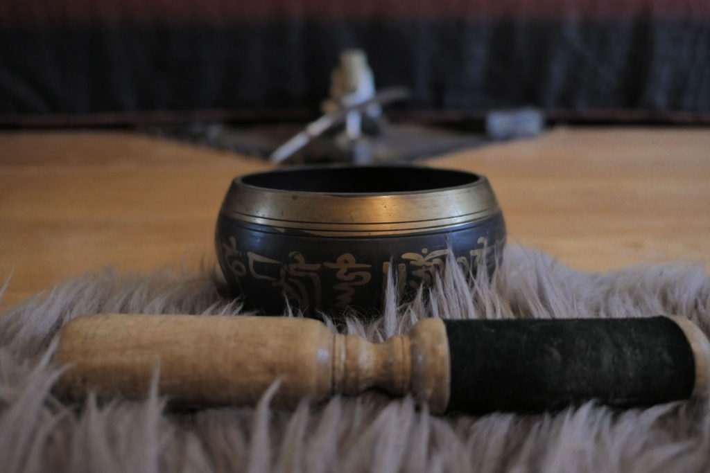 tibet singing bowl on lambwool mat for morning meditation space nextlevelwarrior.com